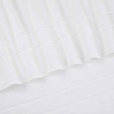 Two white hand towels with a textured, ribbed design.