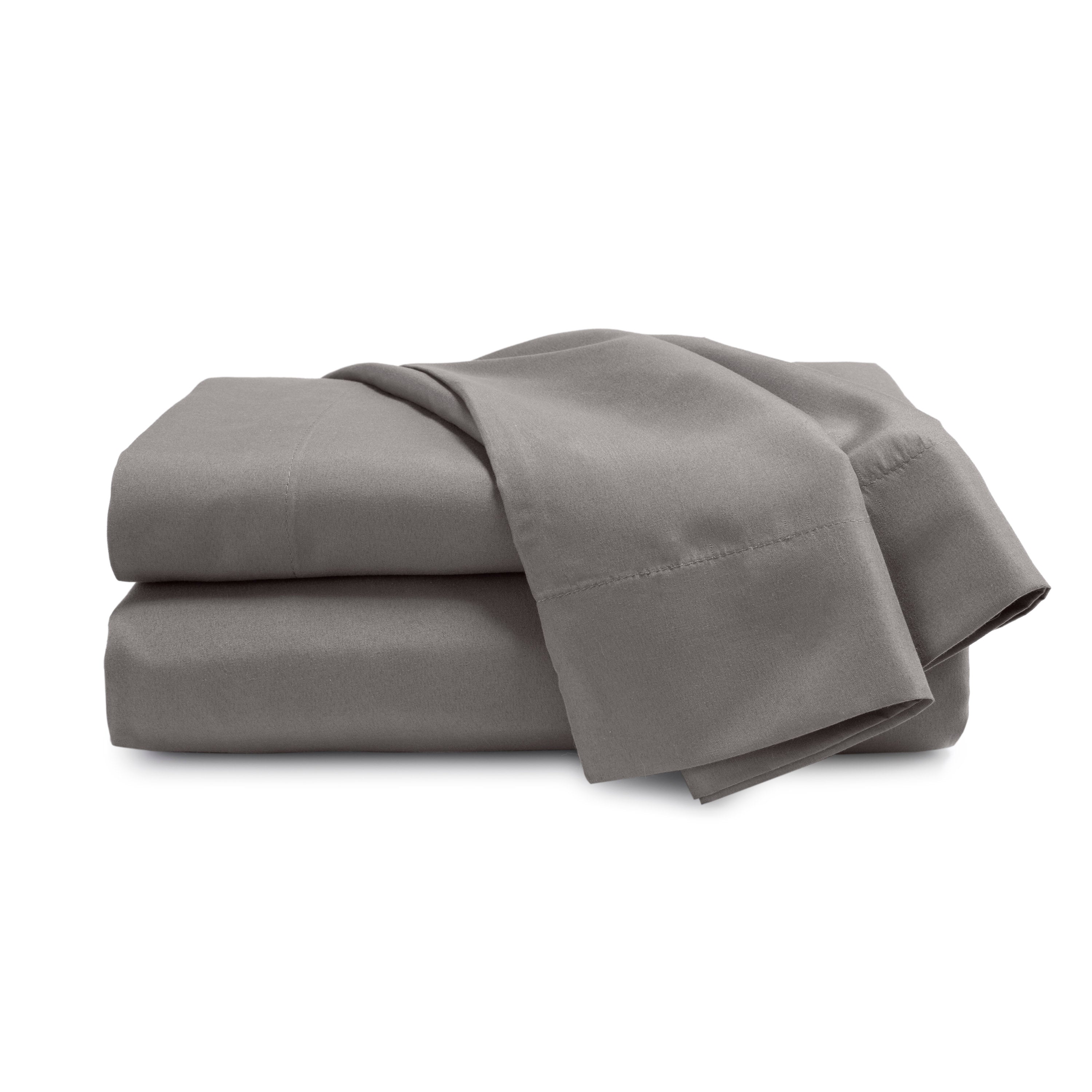 Gray brushed microfiber sheet set neatly folded with a smooth texture.