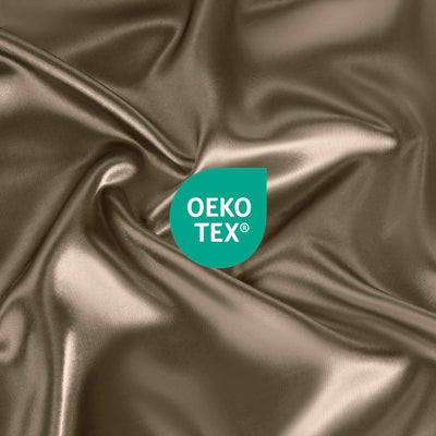 Satin fabric in a warm tone with an Oeko-Tex certification logo displayed prominently.
