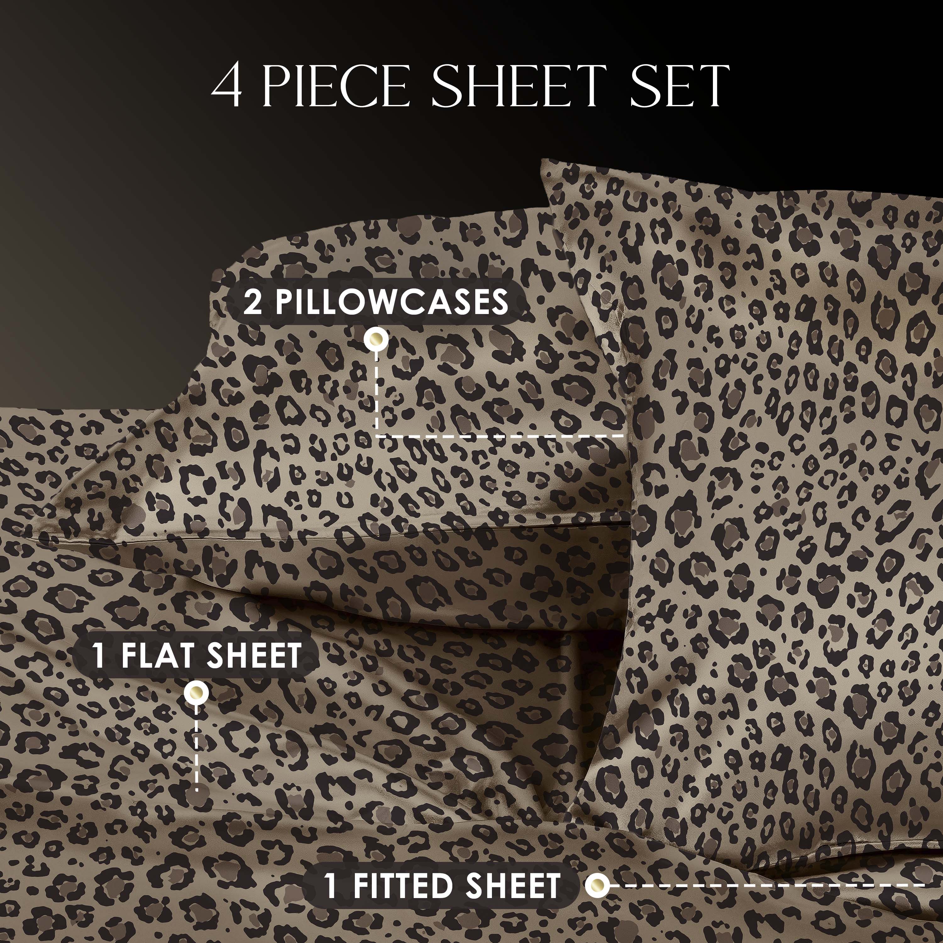 Four-piece satin sheet set featuring a leopard print design, including two pillowcases, one flat sheet, and one fitted sheet.