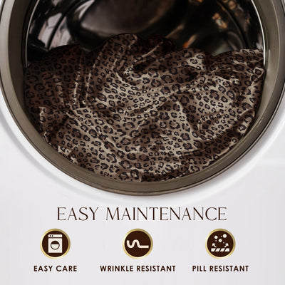 Satin sheet set with a leopard print design inside a washing machine drum.