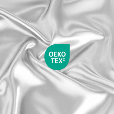 Satin fabric in silver with an Oeko-Tex certification logo displayed prominently.
