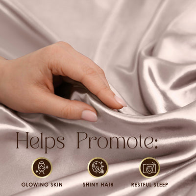 A hand touches a smooth, satin fabric in a soft, light color with text promoting benefits for skin, hair, and sleep.
