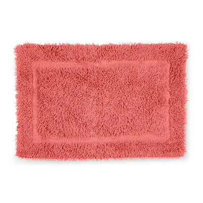 Rectangular bath rug in coral color with a textured, fluffy surface and a bordered design.