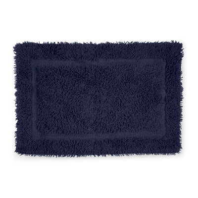 Navy blue bath rug with a plush, textured surface and a rectangular shape.