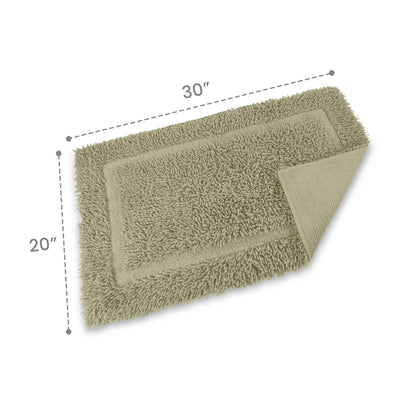 Rectangular bath rug in a soft green color, measuring 30 inches by 20 inches, with a textured surface.