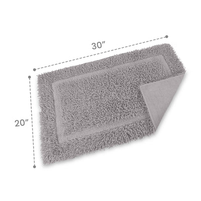 Gray bath rug with a textured surface, measuring 30 inches by 20 inches, featuring a bordered design.