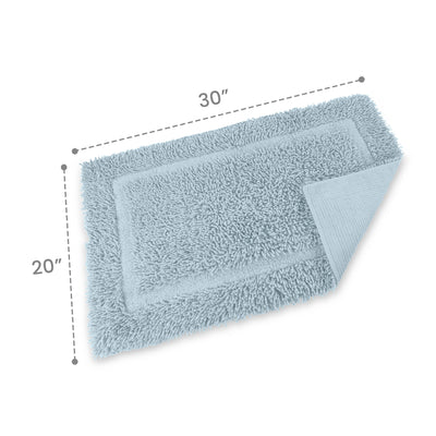 Light blue bath rug with a plush texture, measuring 30 inches by 20 inches, featuring a bordered design.