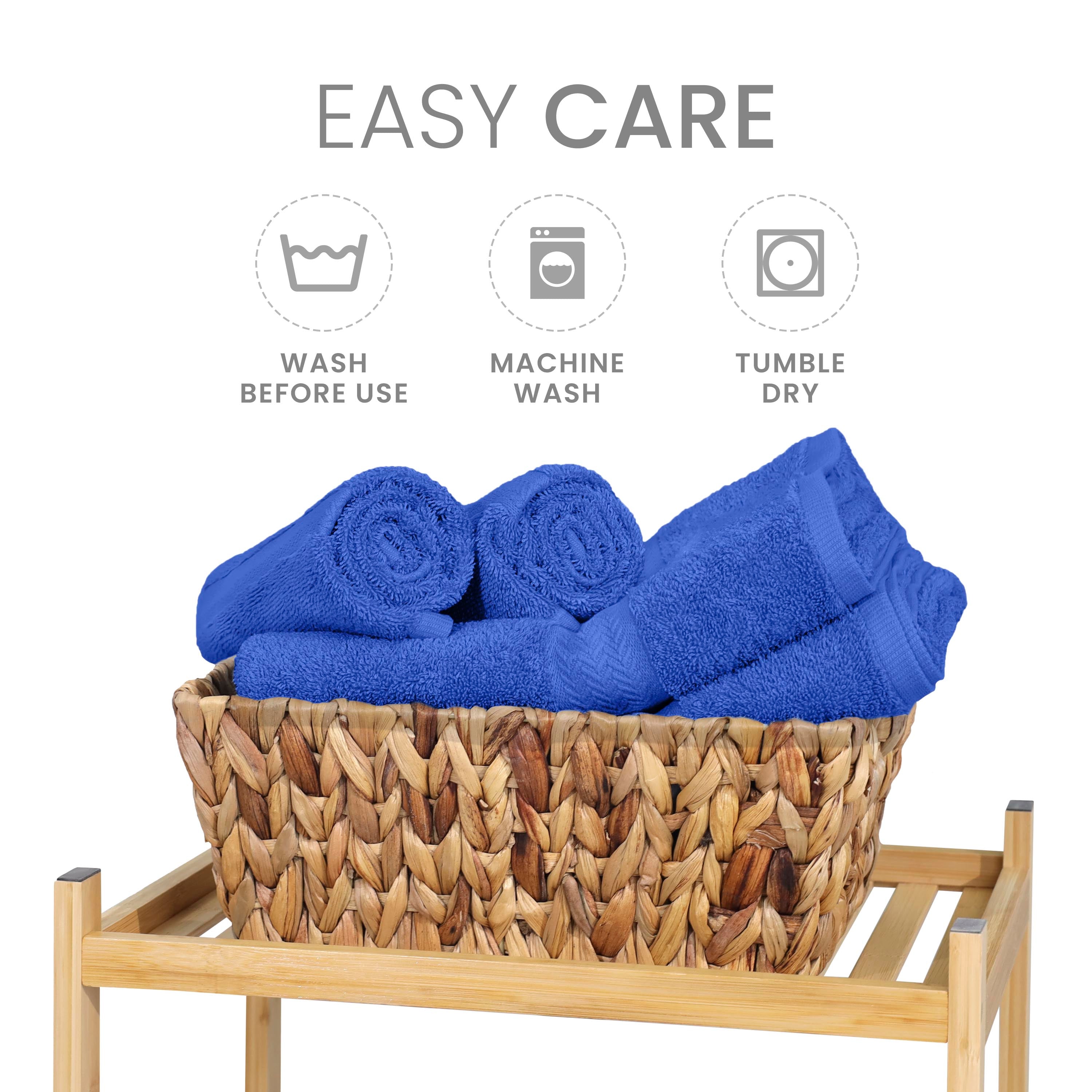 Six blue towels neatly arranged in a woven basket on a wooden shelf, with care instructions displayed above.
