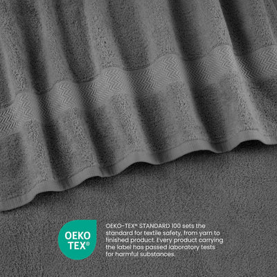 Gray towels with a textured pattern and a label indicating Oeko-Tex certification for textile safety.
