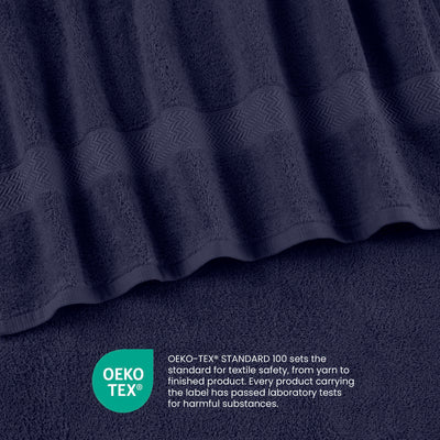Navy blue towels with a textured stripe design and an Oeko-Tex certification label for textile safety.