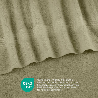 Light green towel set with textured stripes and a smooth border, featuring Oeko-Tex certification label.