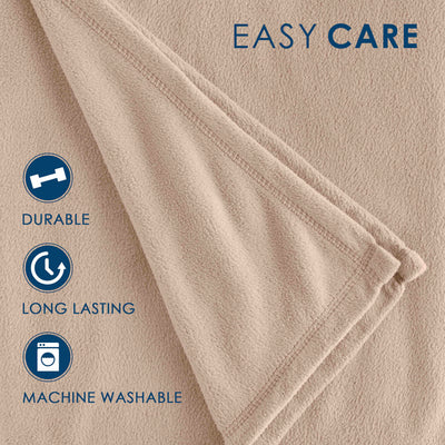 Soft beige fleece blanket with stitched edges and care instructions for durability and machine washability.