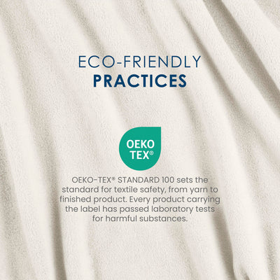 Text on a soft, light-colored fleece blanket highlighting eco-friendly practices and OEKO-TEX® certification for safety.