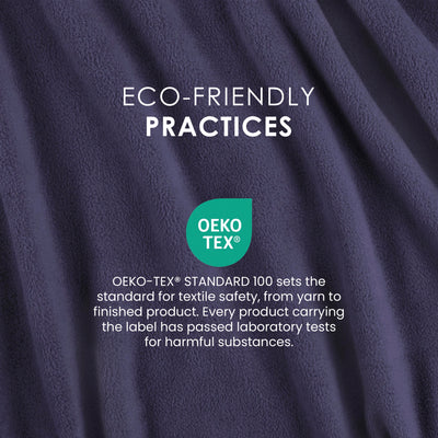 Dark purple fleece fabric with a soft texture, featuring an OEKO-TEX® certification label for textile safety.