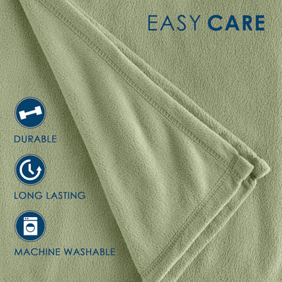 Light green fleece blanket with a soft texture and stitched edges, labeled as durable and machine washable.