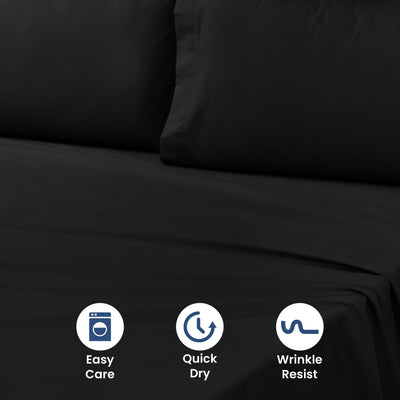 Black sheet set with two pillows on a bed, featuring icons for easy care, quick dry, and wrinkle resistance.