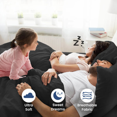 Parent sleeping on a ebony bedding