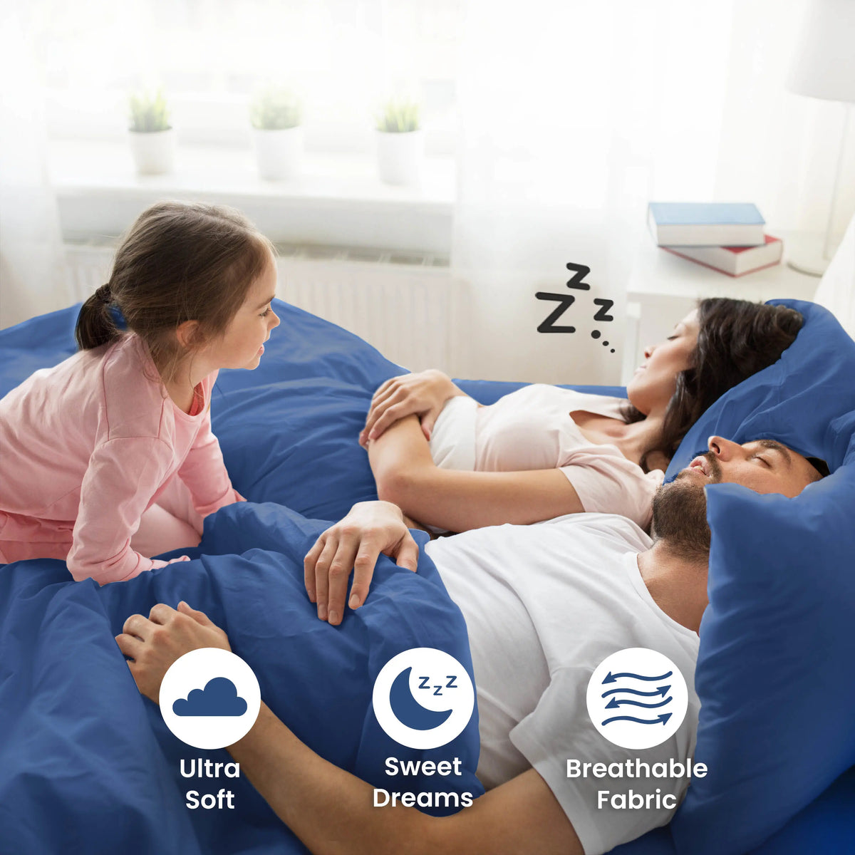 Parent sleeping on a blue bedding