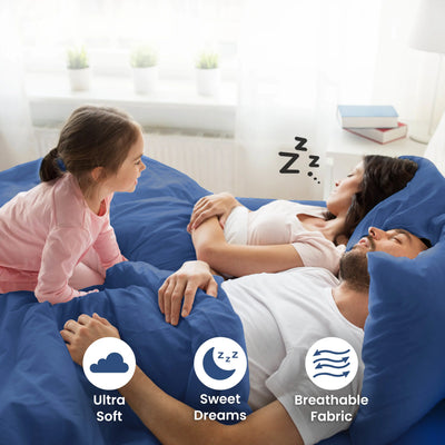 Parent sleeping on a blue bedding