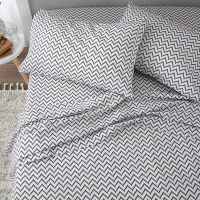 Gray and white chevron patterned sheet set with two matching pillowcases.