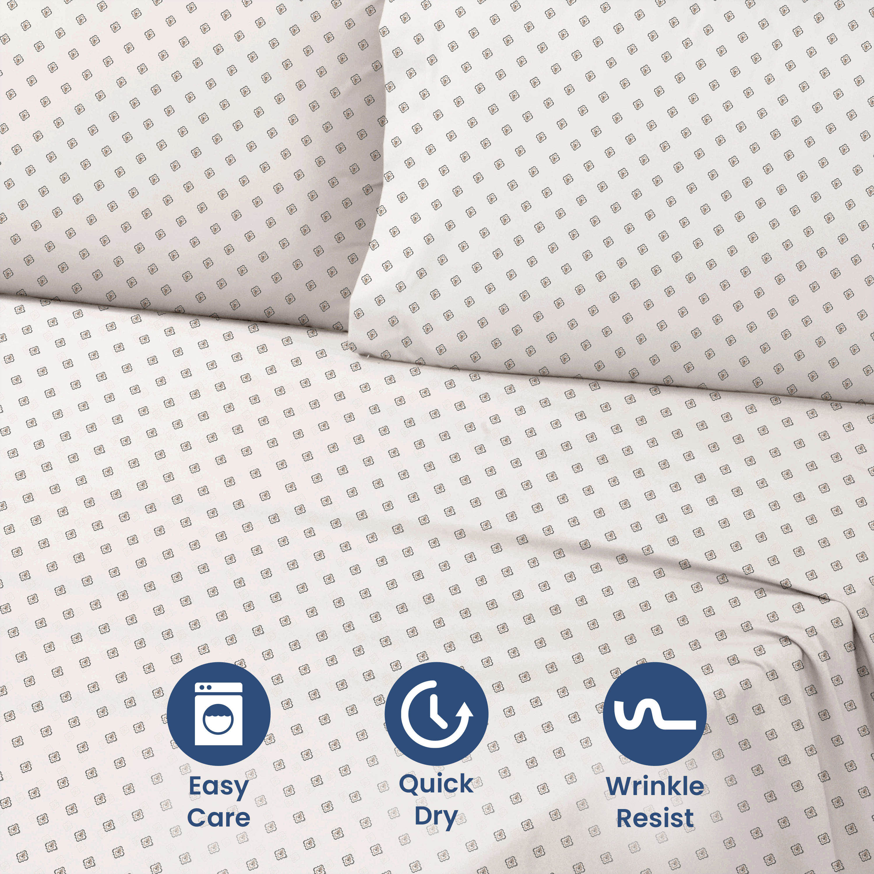 Light-colored sheet set with a geometric pattern, featuring two pillows and visible care icons.