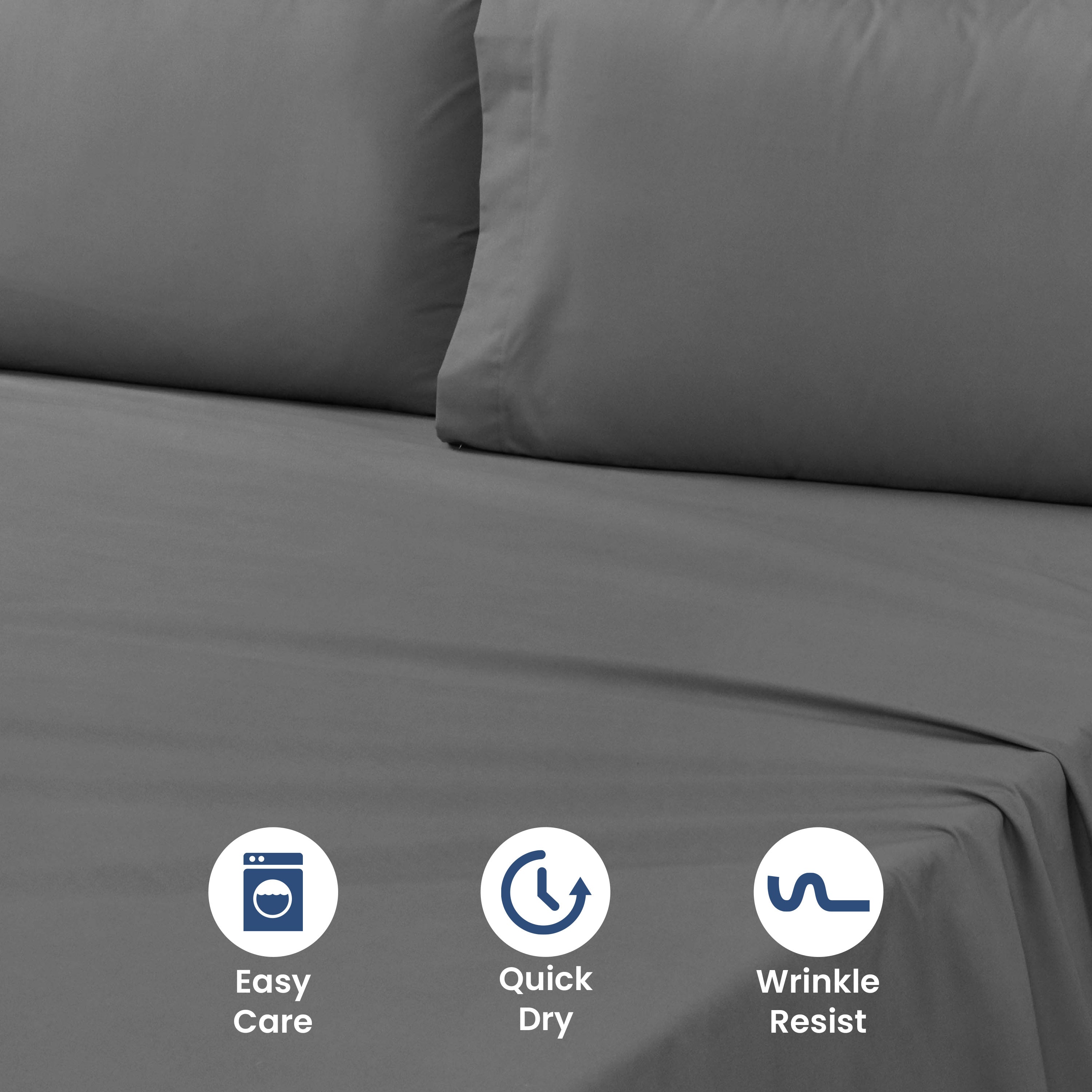 Gray sheet set with two matching pillowcases on a bed, featuring easy care, quick dry, and wrinkle-resistant icons.