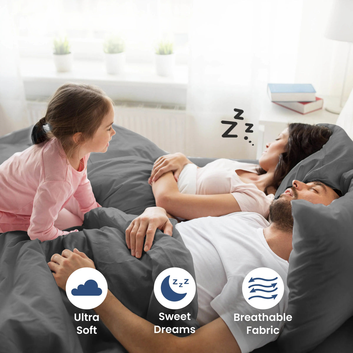 Parent sleeping on a grey bedding