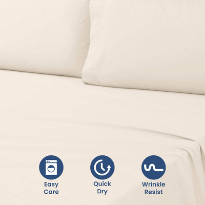 Light beige sheet set with two pillows, featuring care icons for easy care, quick dry, and wrinkle resistance.