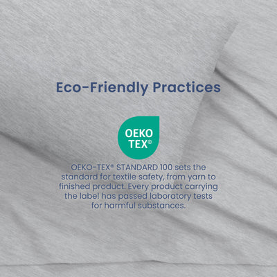 Gray fabric with text about eco-friendly practices and Oeko-Tex certification for textile safety.