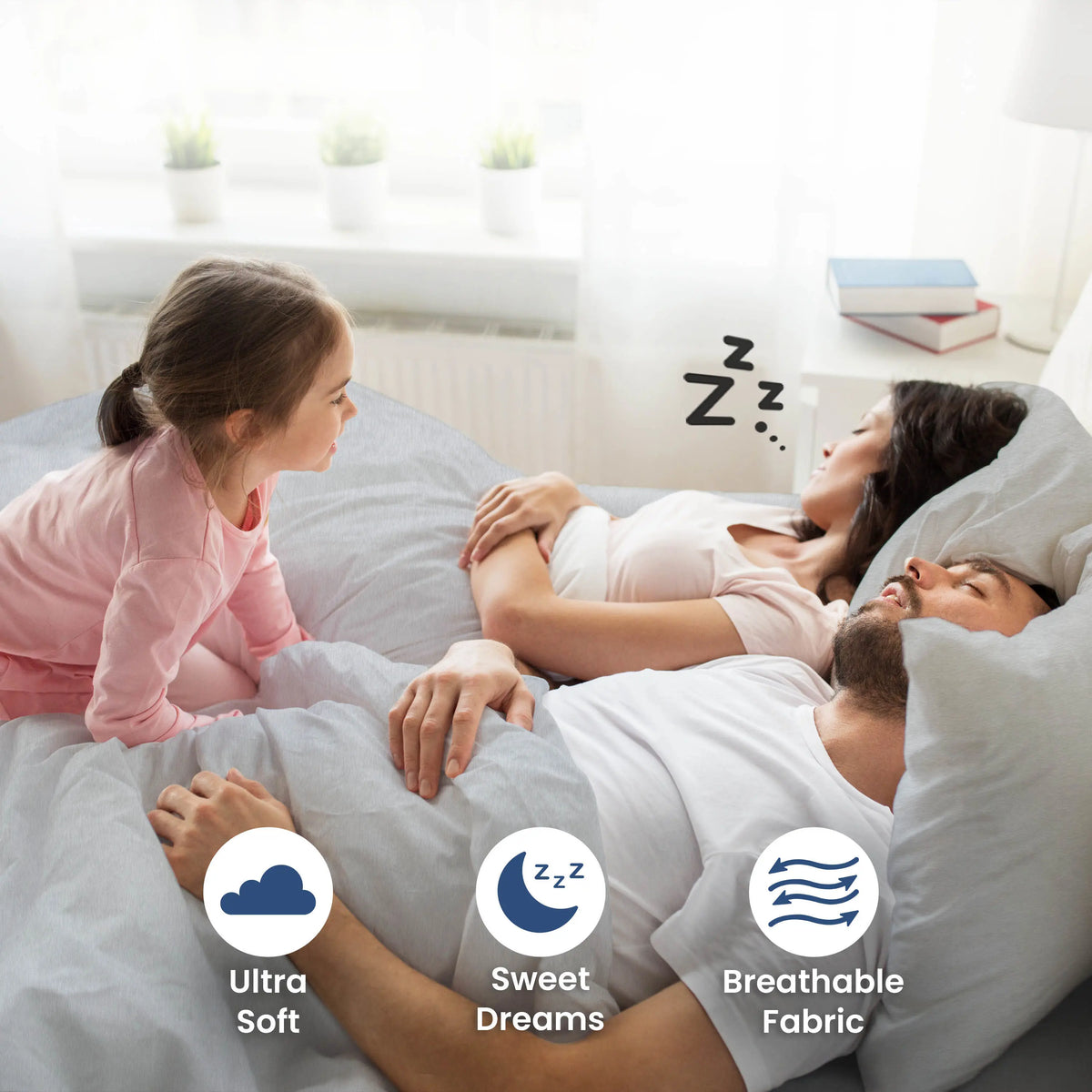 Parent sleeping on a light grey bedding