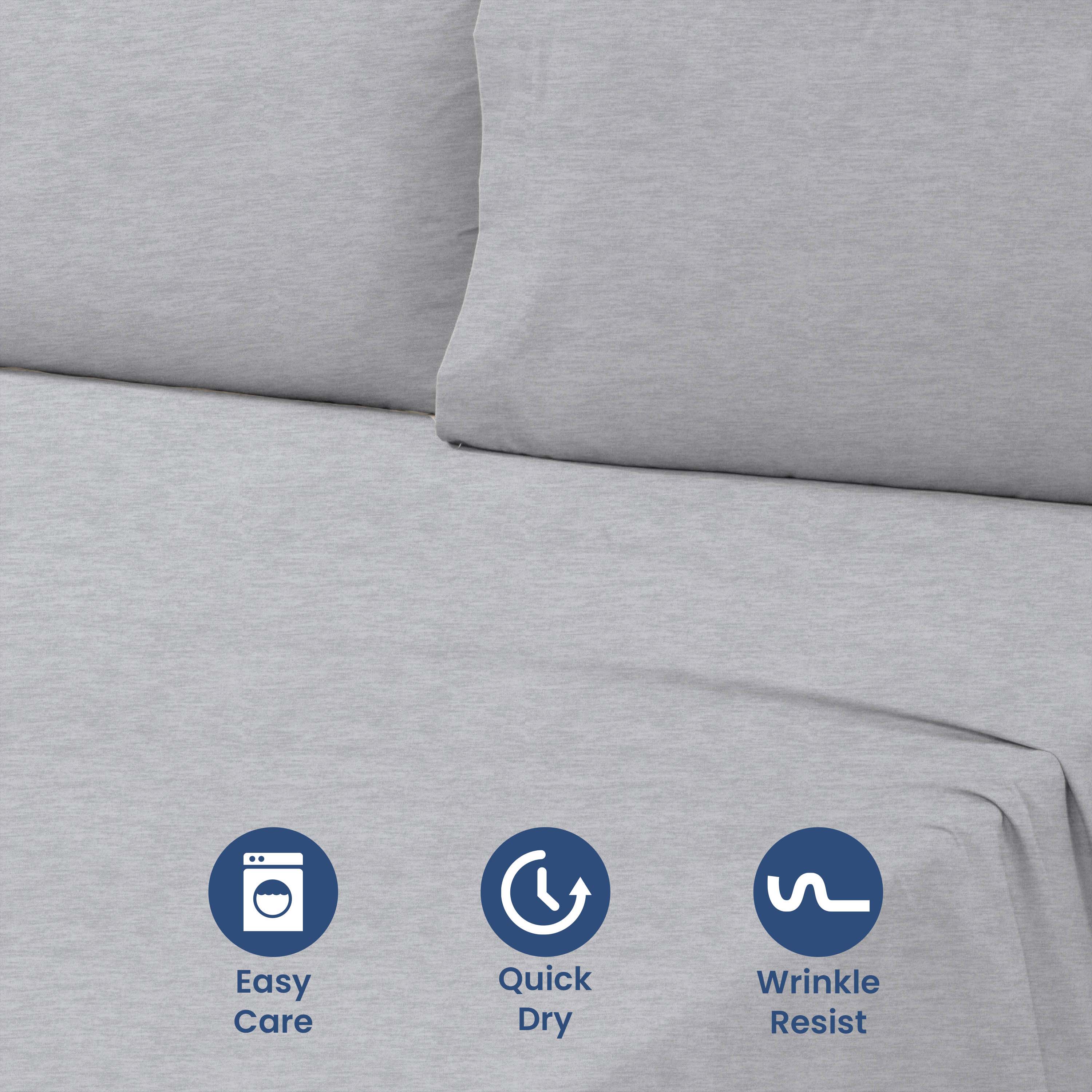 Gray sheet set with two pillowcases, featuring smooth fabric and care icons for easy maintenance.
