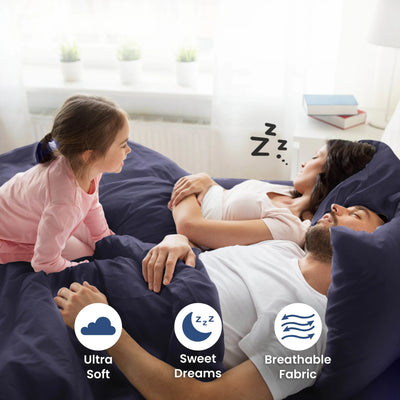 Parent sleeping on a navy bedding