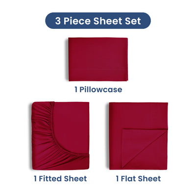 Three-piece sheet set in red includes one fitted sheet, one flat sheet, and one pillowcase.
