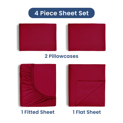 Four-piece sheet set in red, including two pillowcases, one fitted sheet, and one flat sheet.