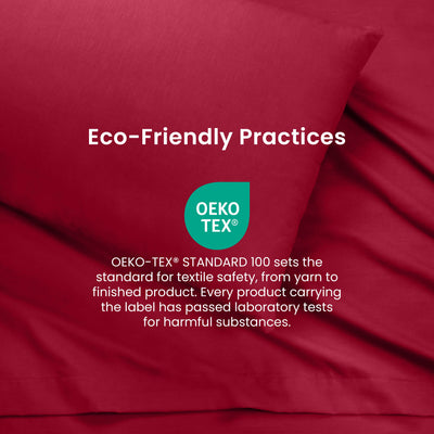 Deep red sheets with a label indicating Oeko-Tex certification for textile safety and eco-friendly practices.