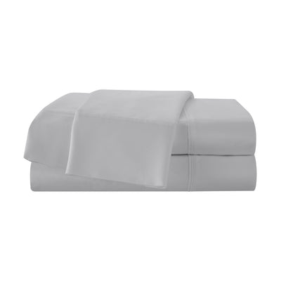 Light gray cotton sheet set stacked neatly, featuring a flat sheet and fitted sheet with subtle stitching details.