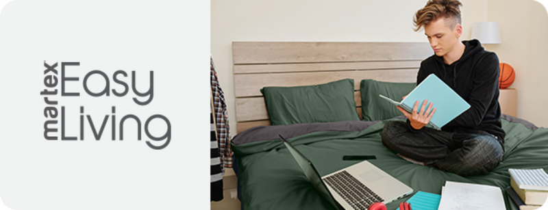 Person using a laptop on a bed with 'Marlex Easy Living' branding.