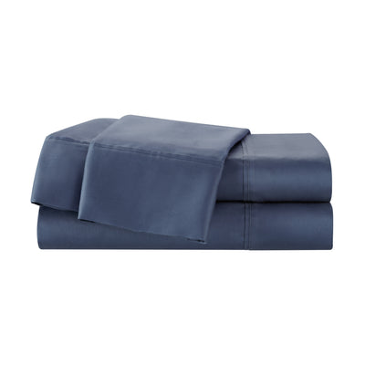 Navy blue cotton sheet set featuring a smooth finish and folded design.
