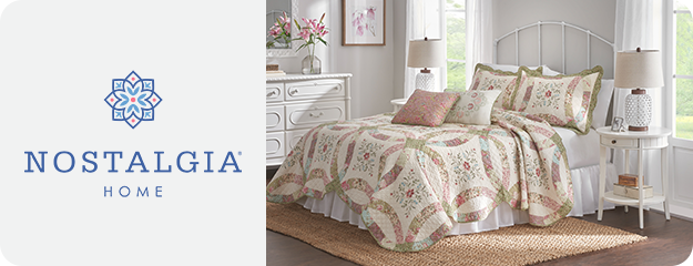 Bedroom scene with floral bedding and Nostalgia Home logo on the left.