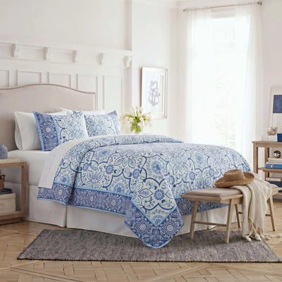 Side view image of the comforter set on a bed