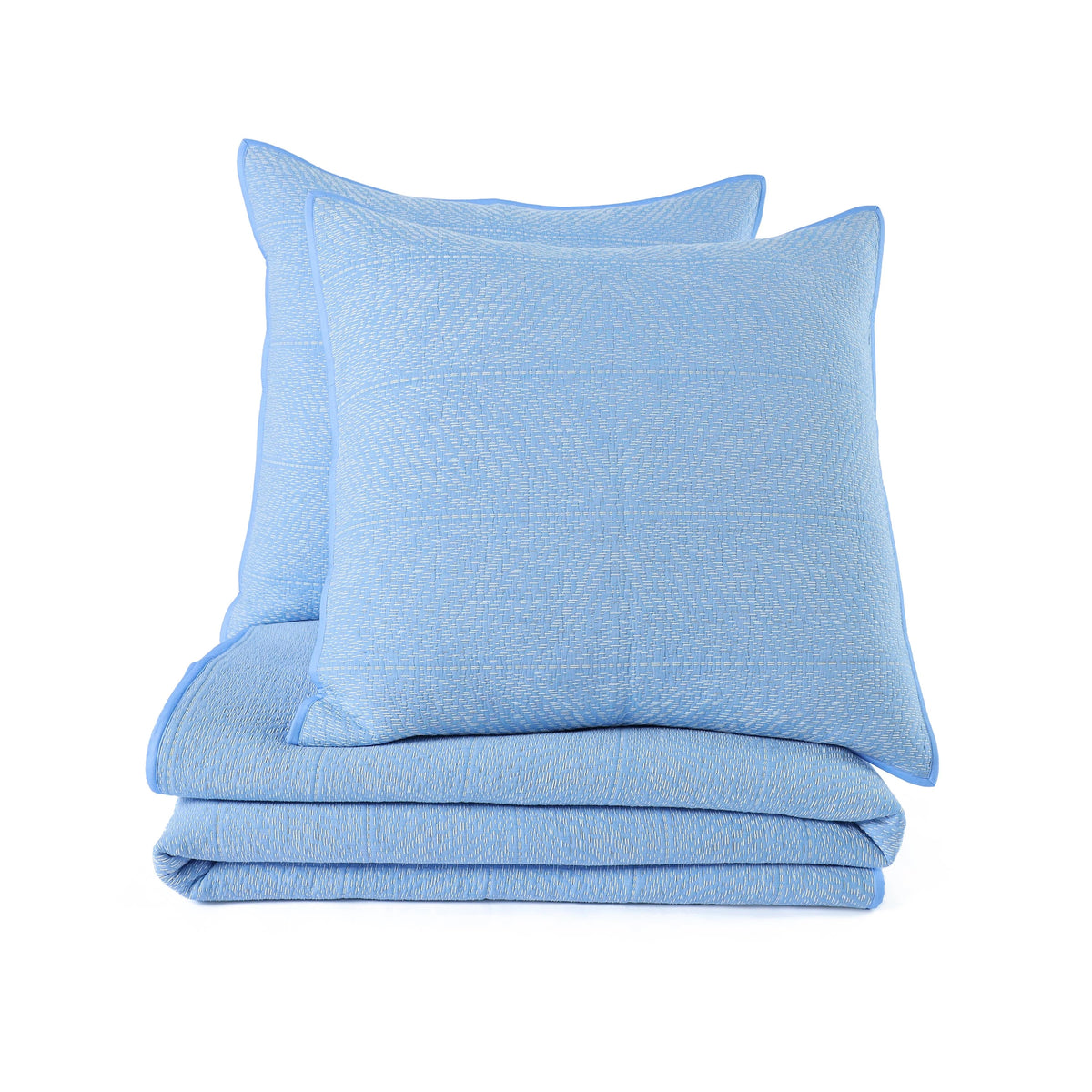 Stack shot of blue quilt and sham with a white background.