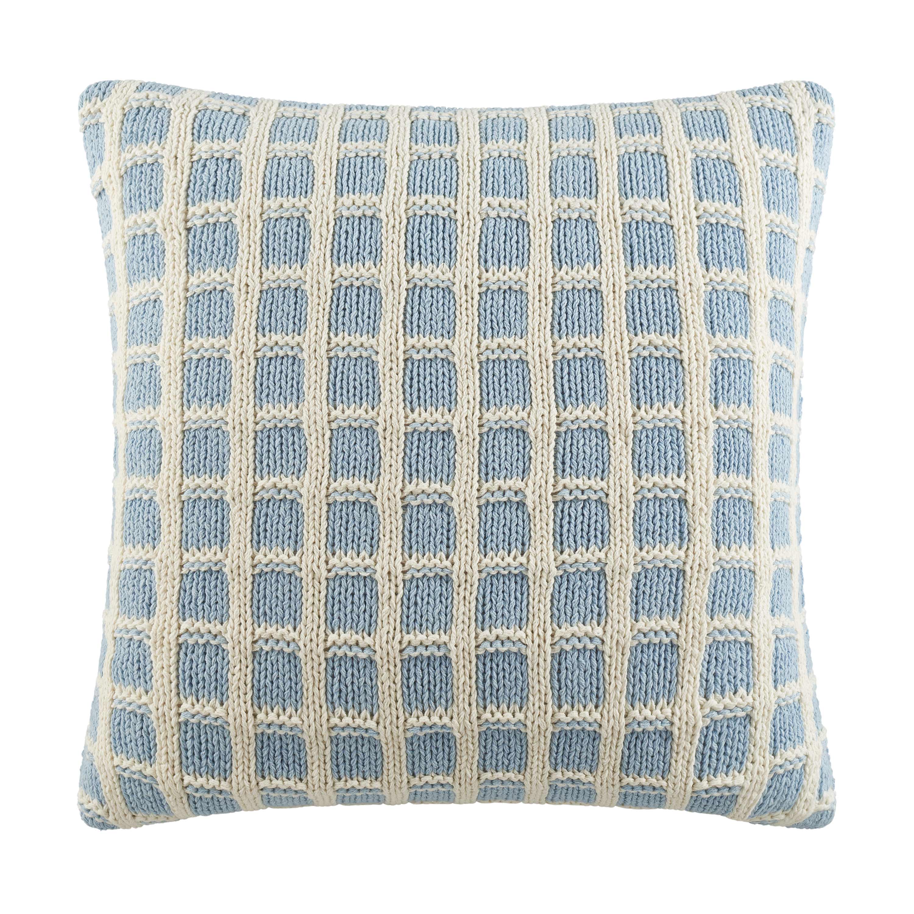 Square decorative pillow featuring a chambray blue and ivory grid pattern.