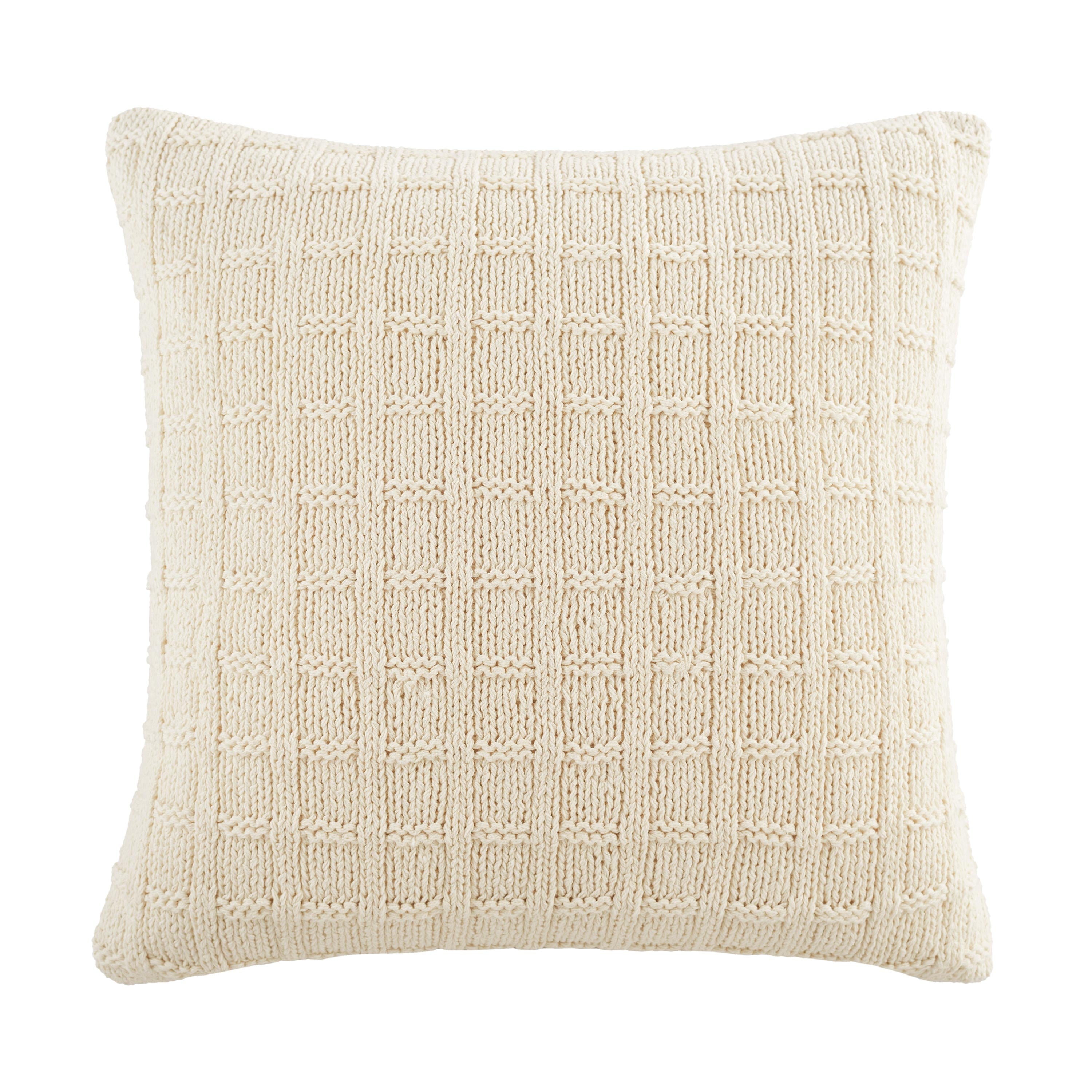Square ivory decorative pillow with a textured knitted pattern.