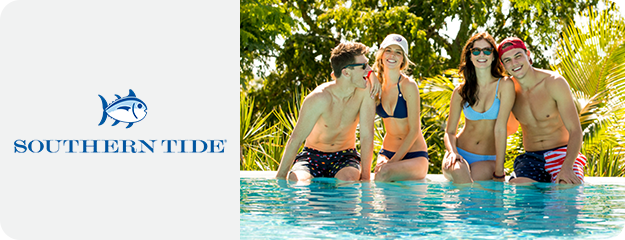 Four people in swimsuits posing in a pool with Southern Tide logo.