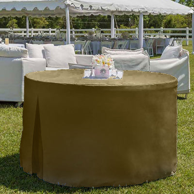 Round table covered with a solid brown table cover, set outdoors with a floral centerpiece.
