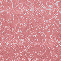 Textured pink fabric with a white floral and scroll pattern.