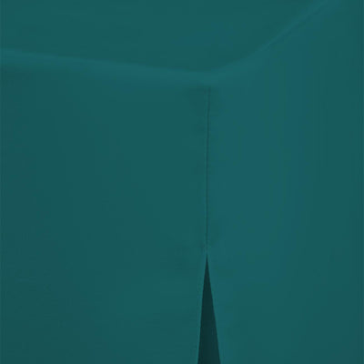 Teal round table cover with a seam and a slit at the edge for a 60-inch table.
