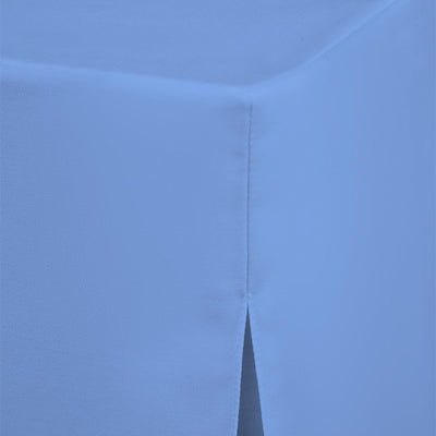 Round table cover in solid blue fabric with a seam and slit detail at the edge.