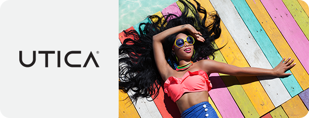 Woman lying on a colorful wooden floor with 'UTICA' branding.